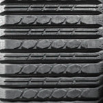 Multi-Bar tread close-up – OEM-spec skid steer track, turf-safe contact